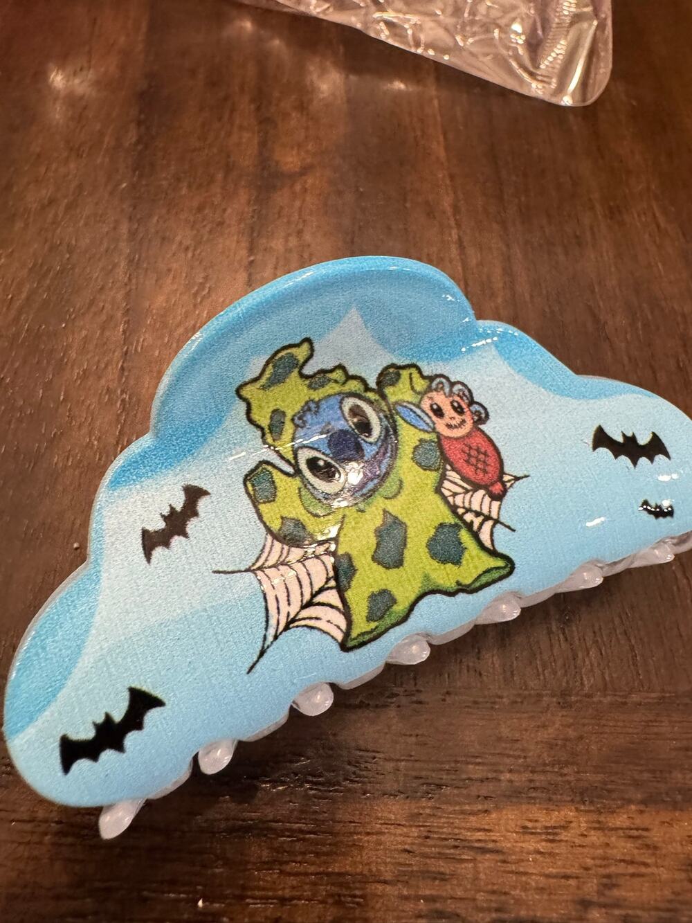 Disney Lilo and Stitch Halloween hair clip with green monster graphic and bats